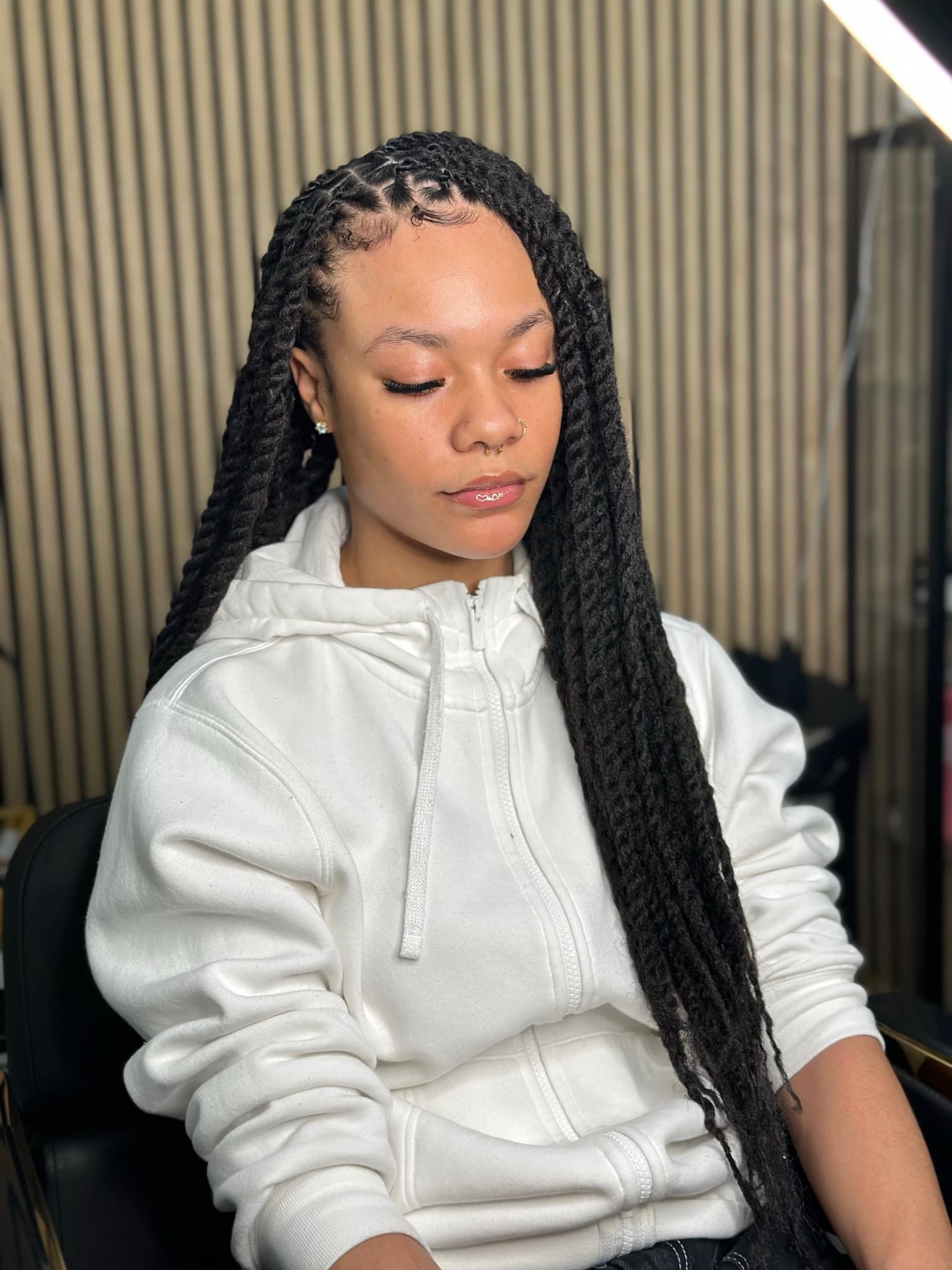 Long braid style finished by BGR Hair Studios
